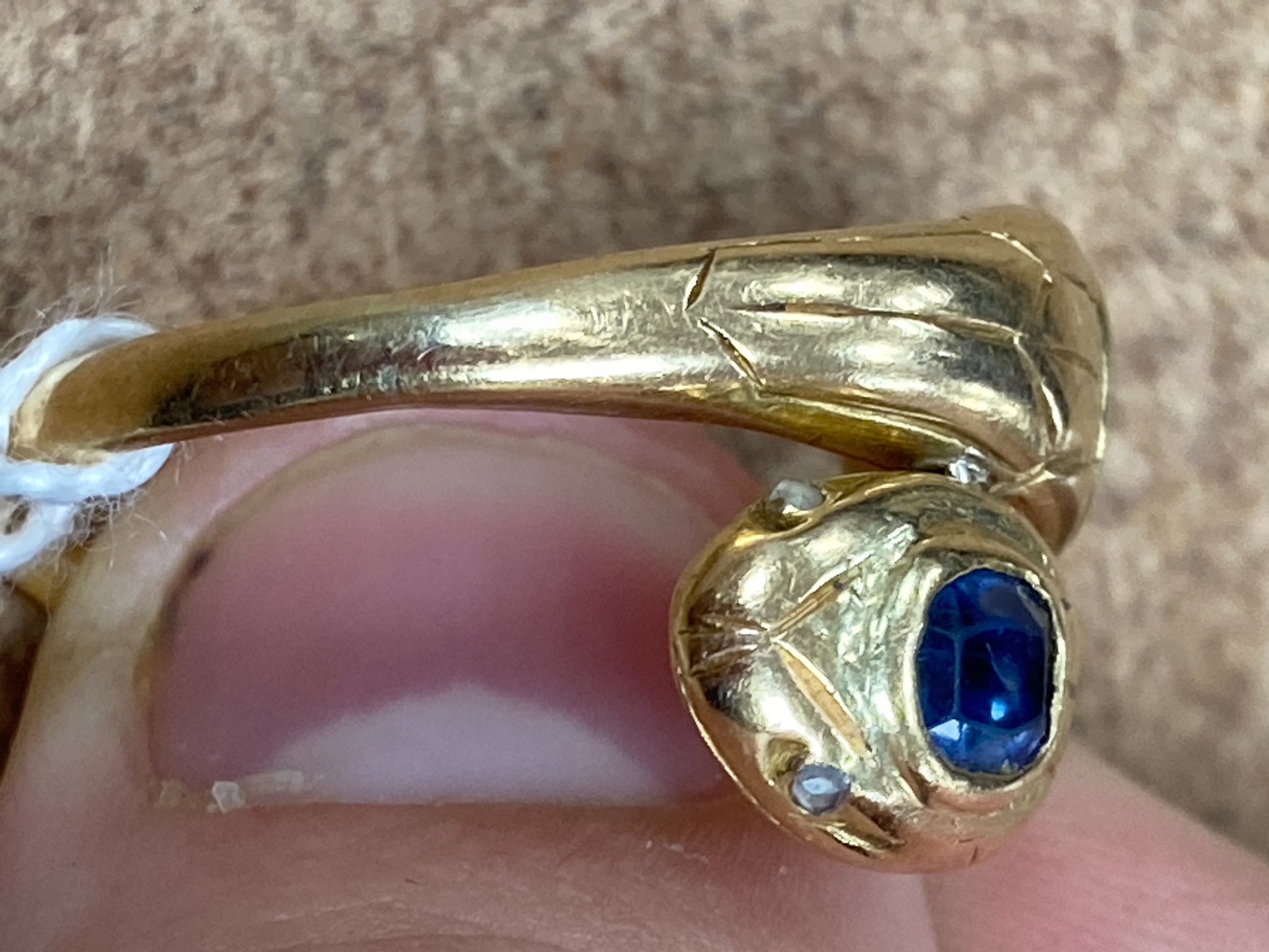 An 18ct yellow gold double 'cobra' ring, sapphire and ruby set, size Q/R, gross 7.6 grams.